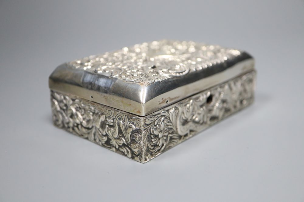 A late Victorian repousse silver mounted lidded rectangular box, with compartmental wooden interior, London, 1895 (a.f.),